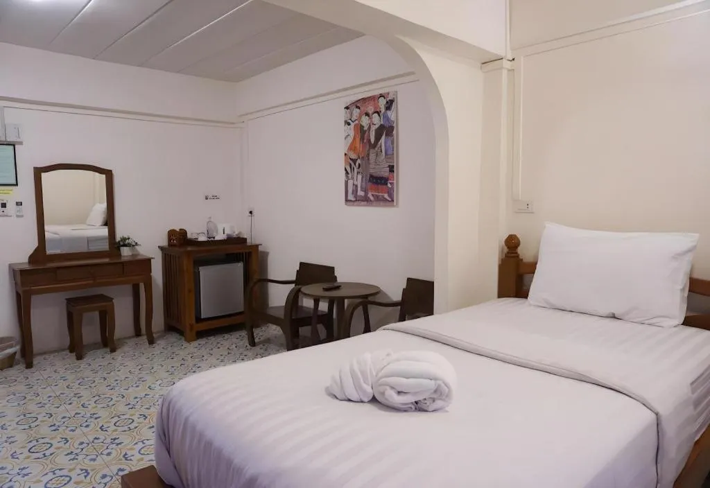 Bed in Nan Lanna Hotel