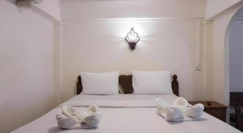 Bed in Nan Lanna Hotel