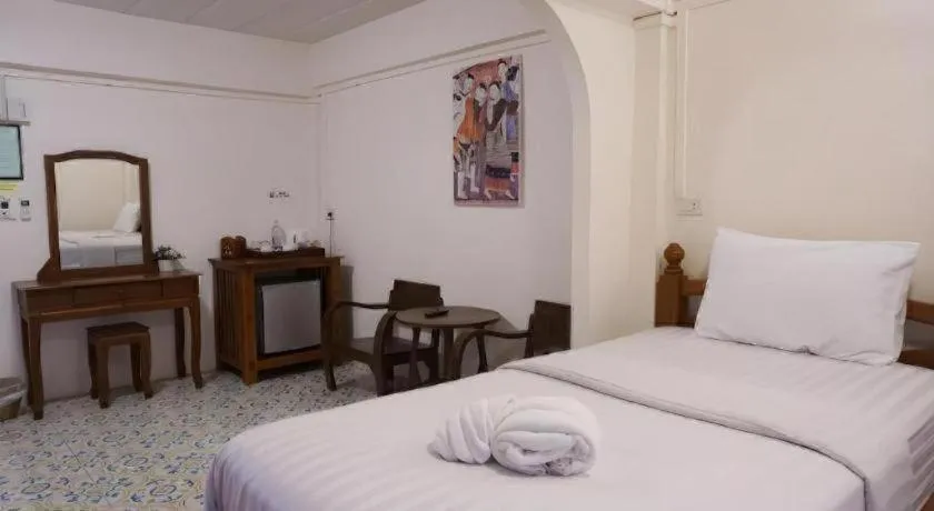 Bed in Nan Lanna Hotel