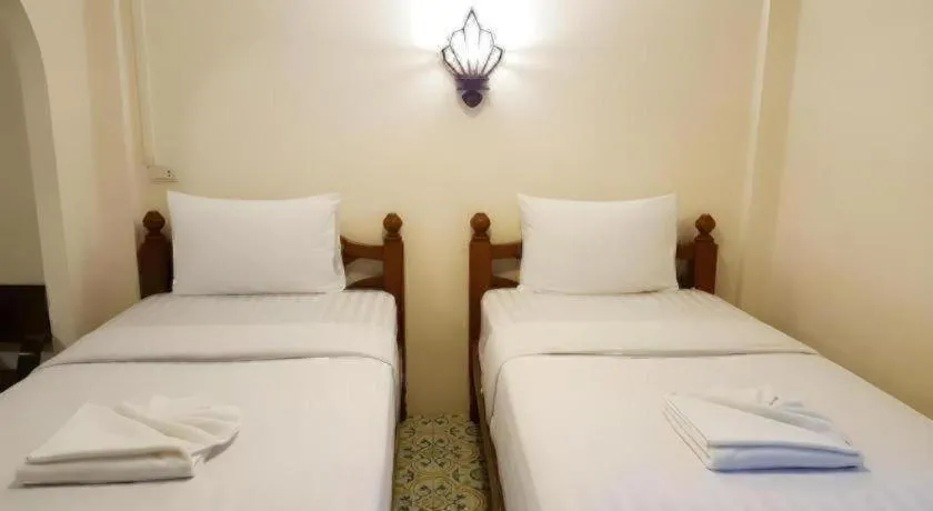 Bed in Nan Lanna Hotel