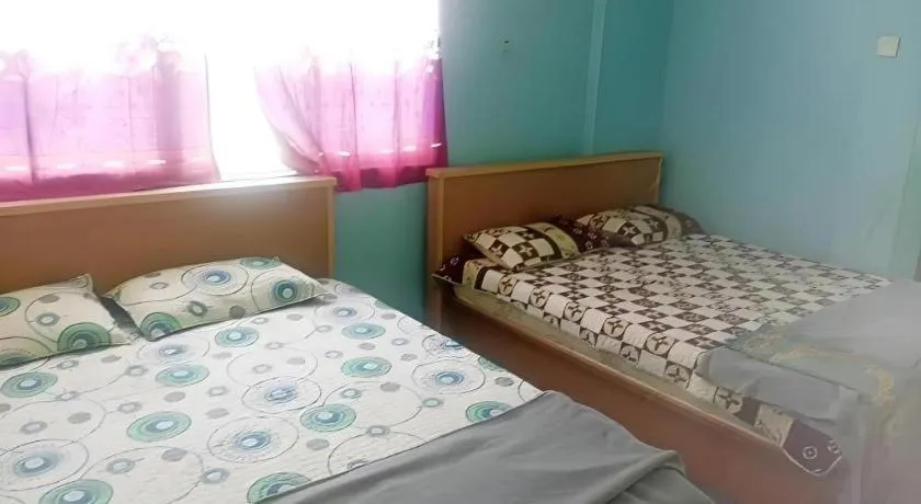 Bed in OYO 90471 Hotel Tepoh