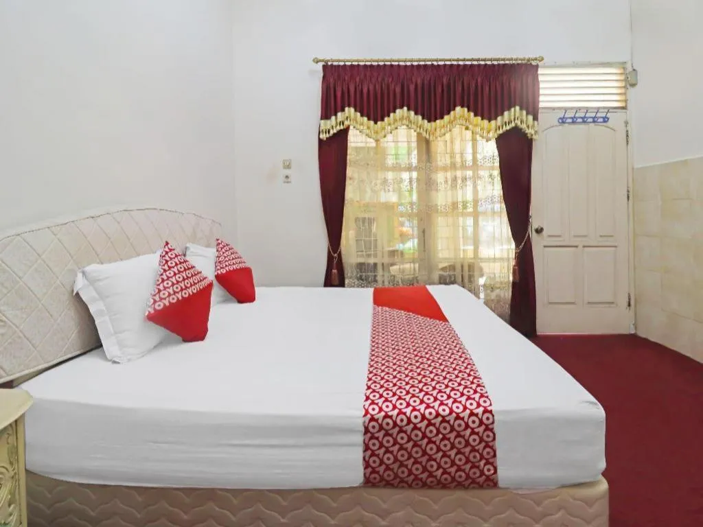 Bed in OYO 2899 Ardilia Bandara Syariah