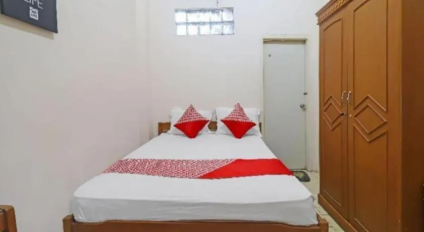 Bed in OYO 2899 Ardilia Bandara Syariah