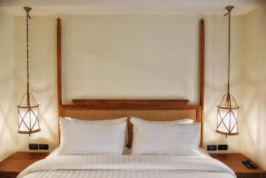 Bed in De Manor Chiang Mai Hotel