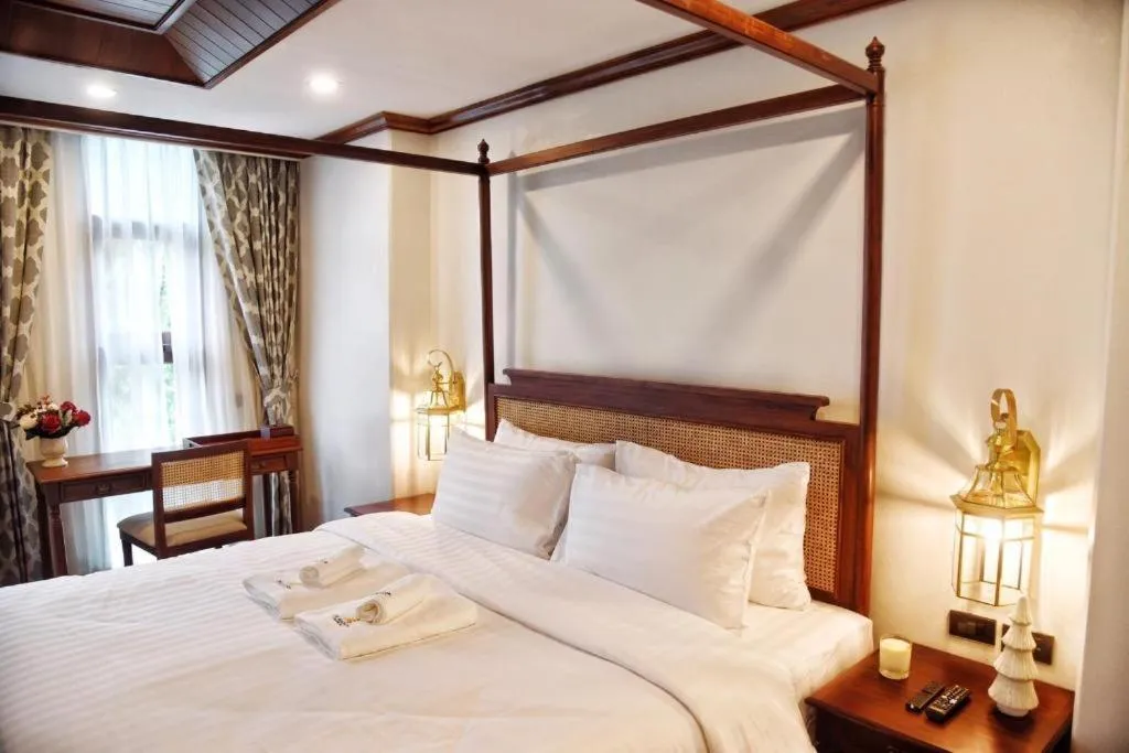 Bed in De Manor Chiang Mai Hotel