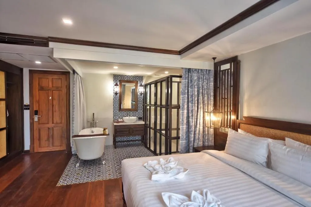 Bed in De Manor Chiang Mai Hotel