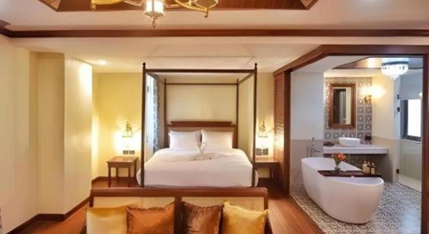 Bed in De Manor Chiang Mai Hotel