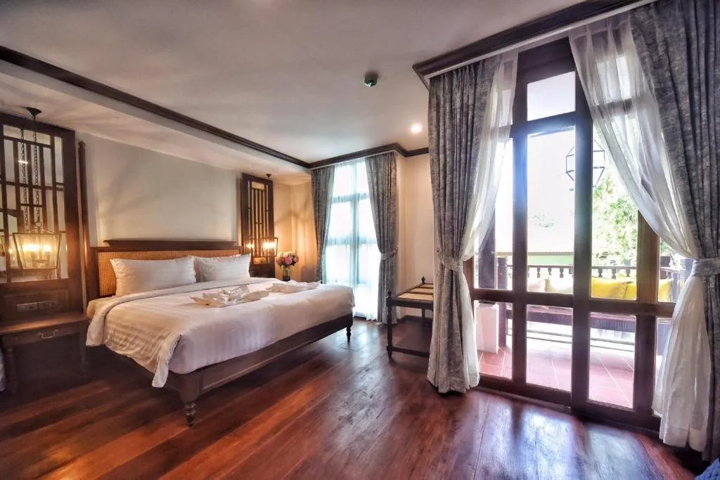 Bed in De Manor Chiang Mai Hotel