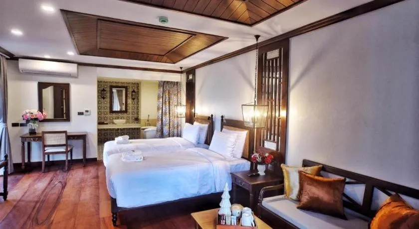 Bed in De Manor Chiang Mai Hotel