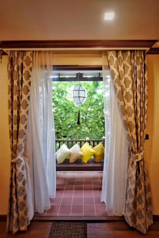 Bed in De Manor Chiang Mai Hotel