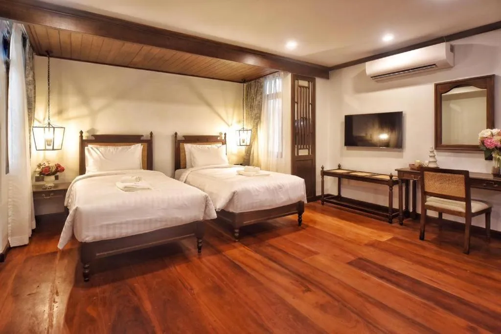 Bed in De Manor Chiang Mai Hotel