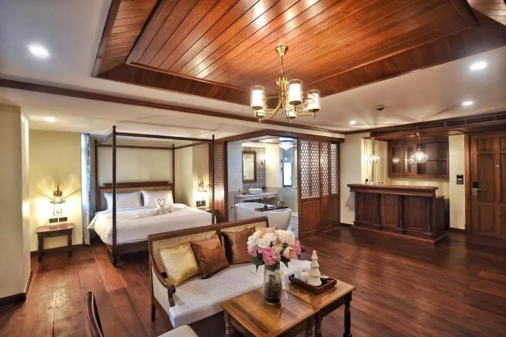 Bed in De Manor Chiang Mai Hotel