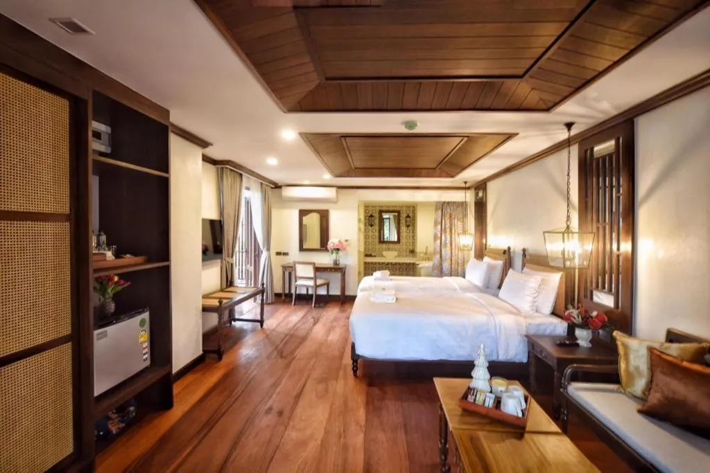 Bed in De Manor Chiang Mai Hotel