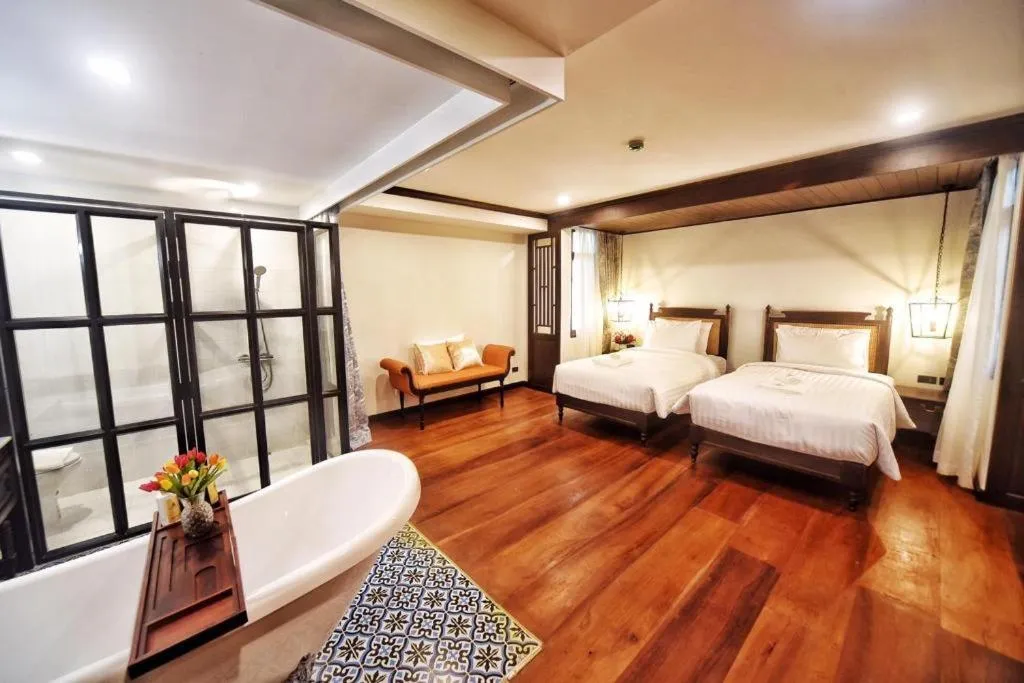 Bed in De Manor Chiang Mai Hotel