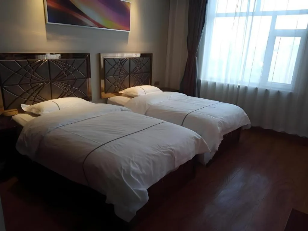 Bed in GreenTree Inn Geermu Walking Street Business Hotel