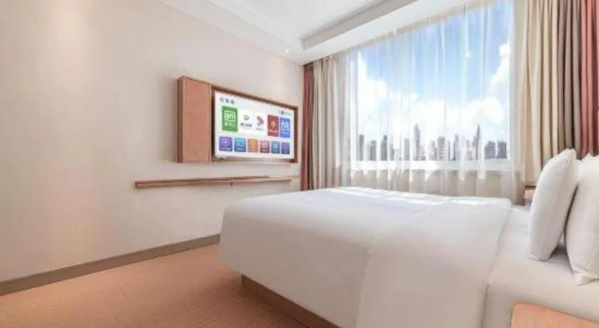 Bed in GreenTree Inn Geermu Walking Street Business Hotel