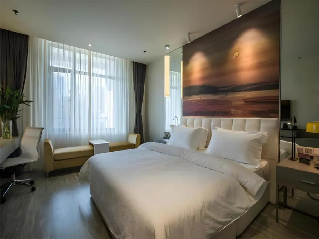 Bed in Jinjiang Metropolo Hotel Shenyang Country Garden Datong Lake Subway Station Branch