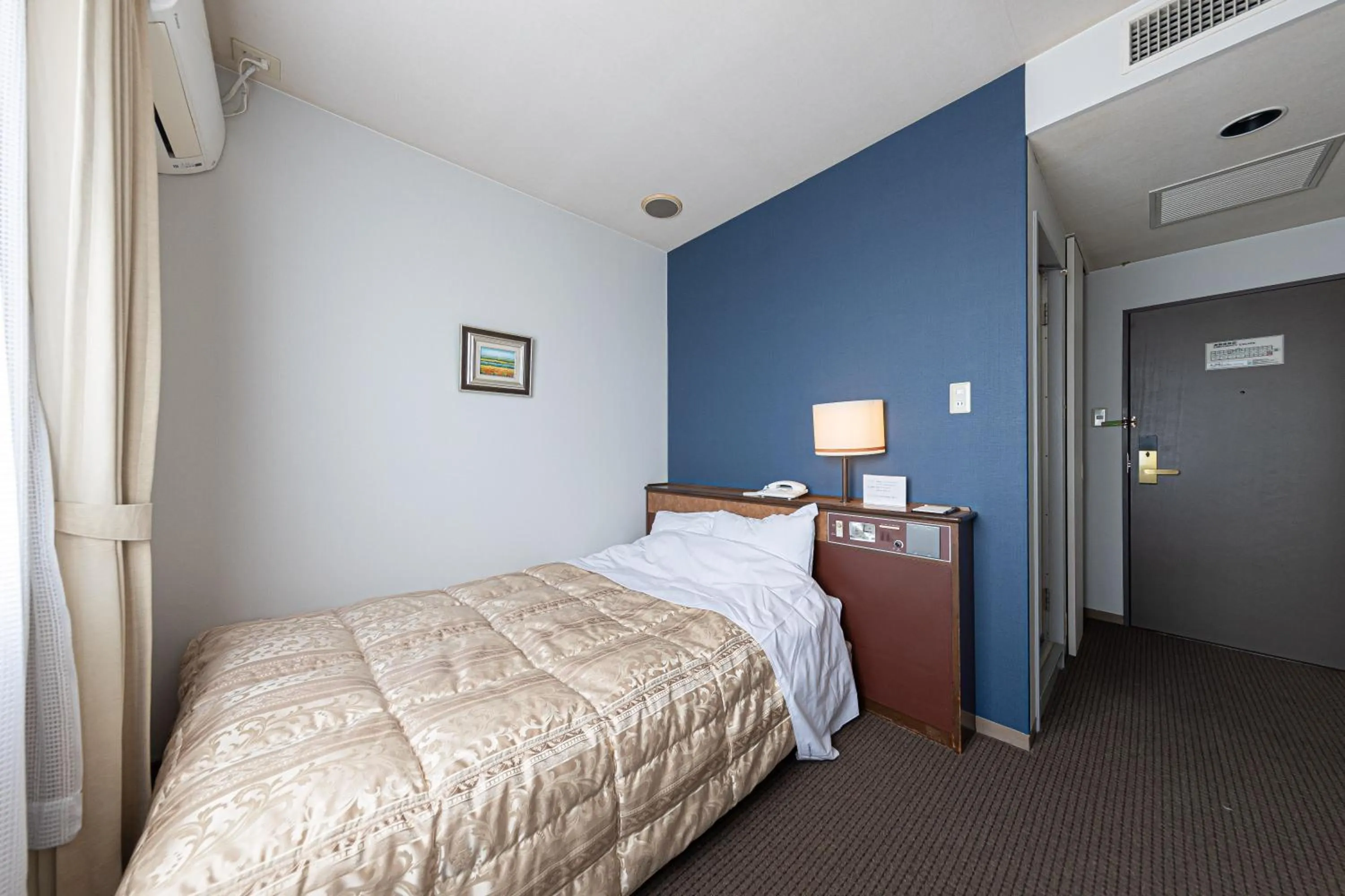 Bed in GARDEN HOTEL Hanayo