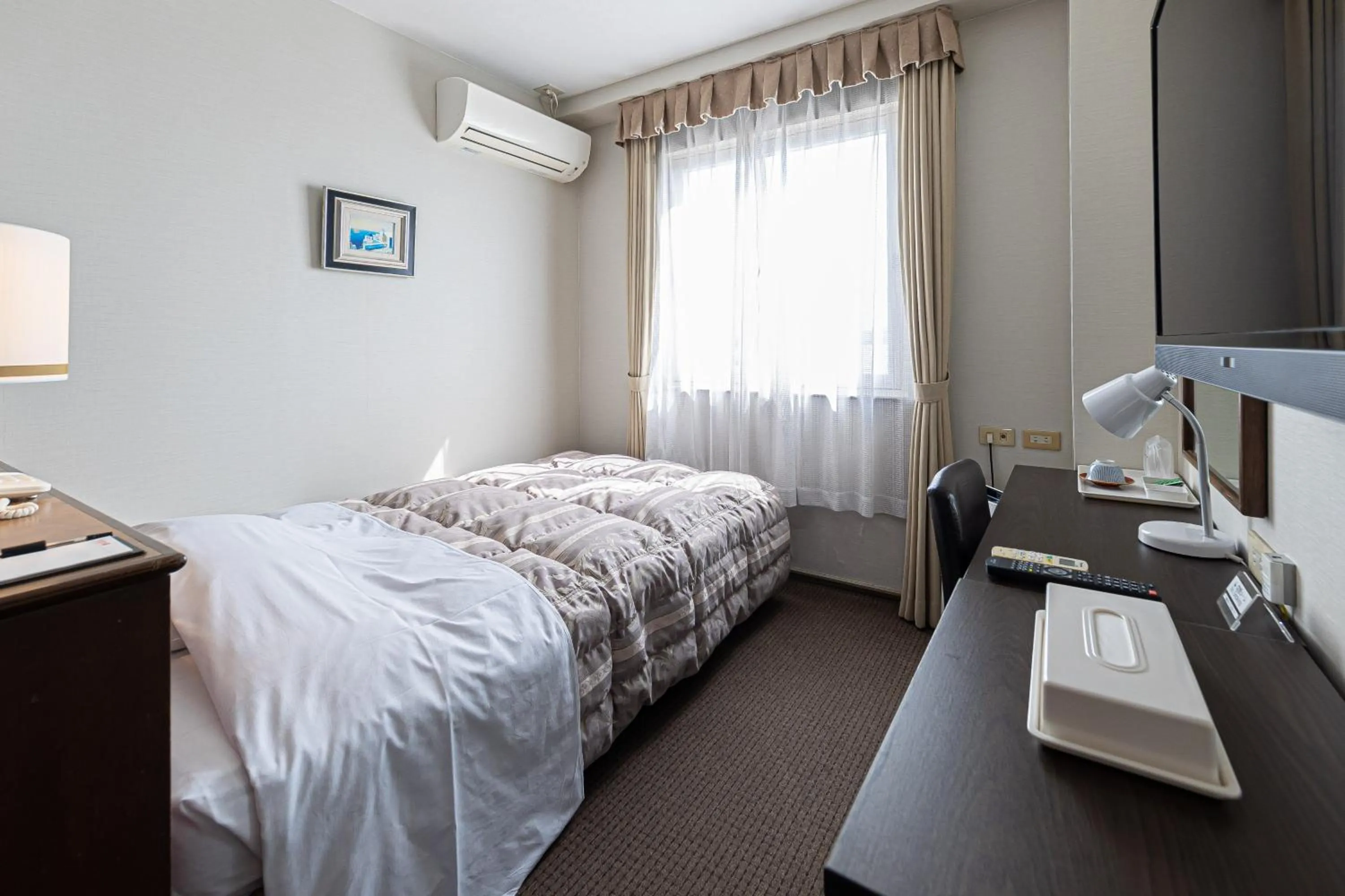 Bed in GARDEN HOTEL Hanayo