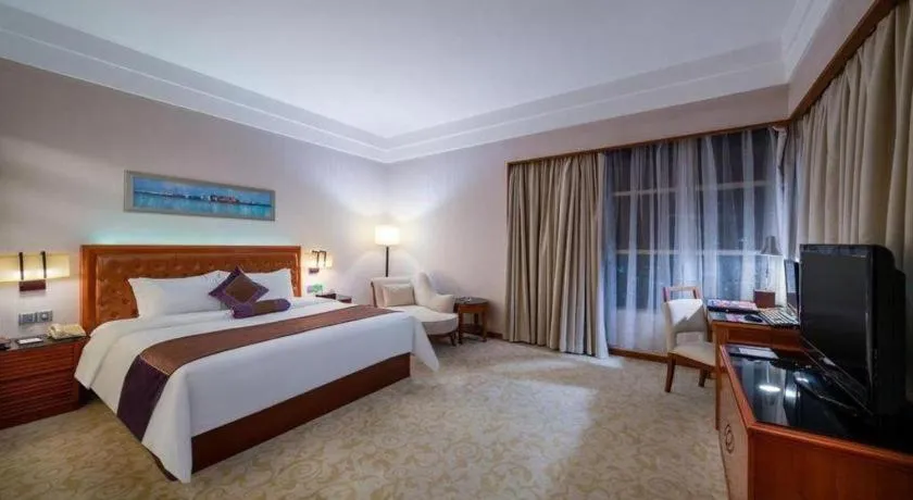 Bed in Yihao International Hotel