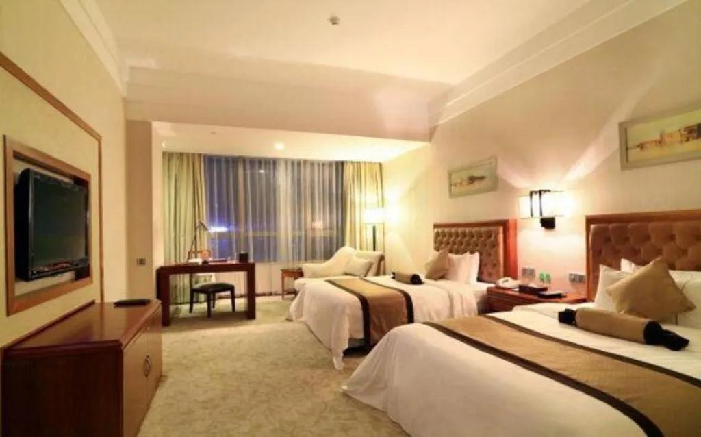 Bed in Yihao International Hotel