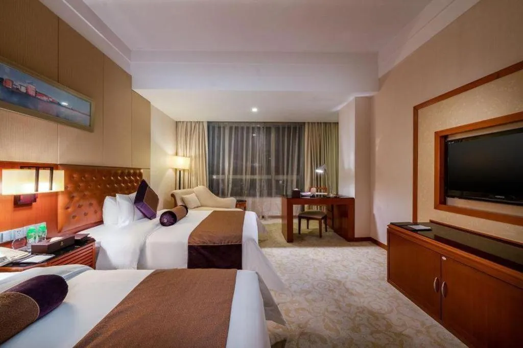 Bed in Yihao International Hotel