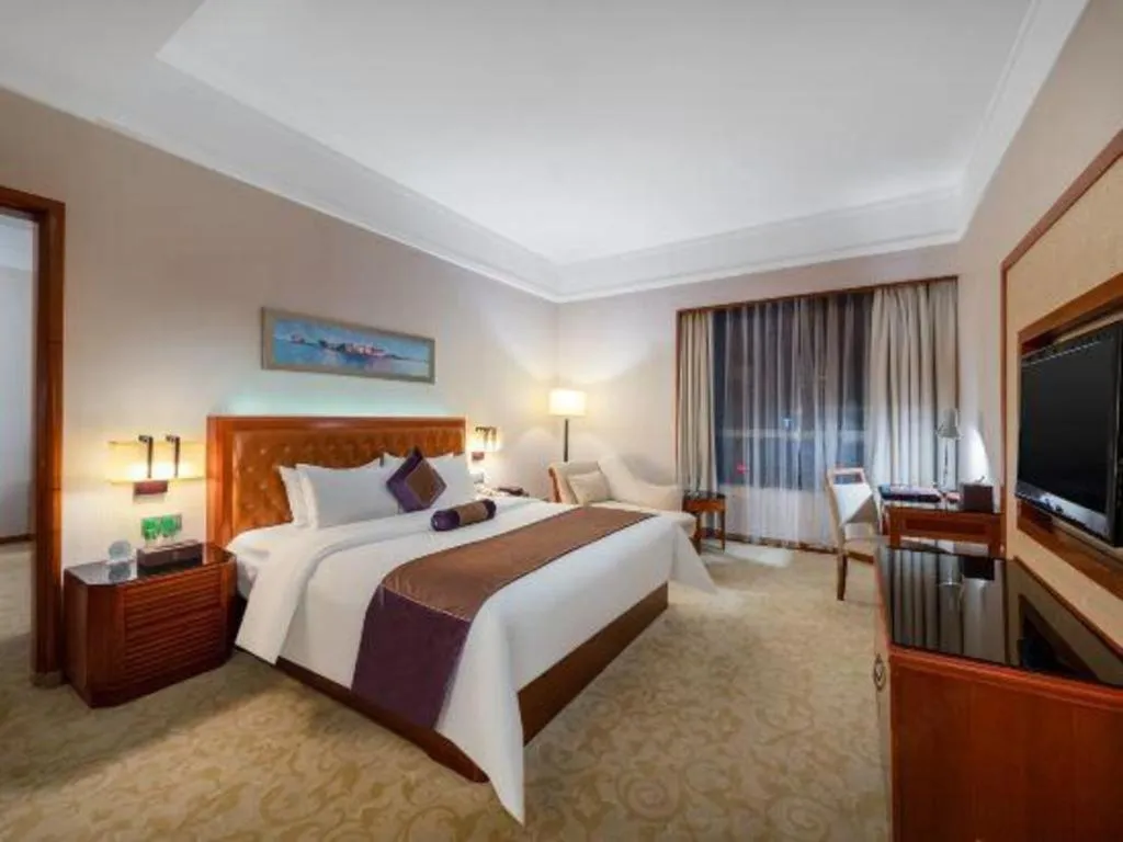 Bed in Yihao International Hotel