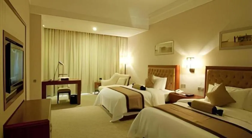 Bed in Yihao International Hotel