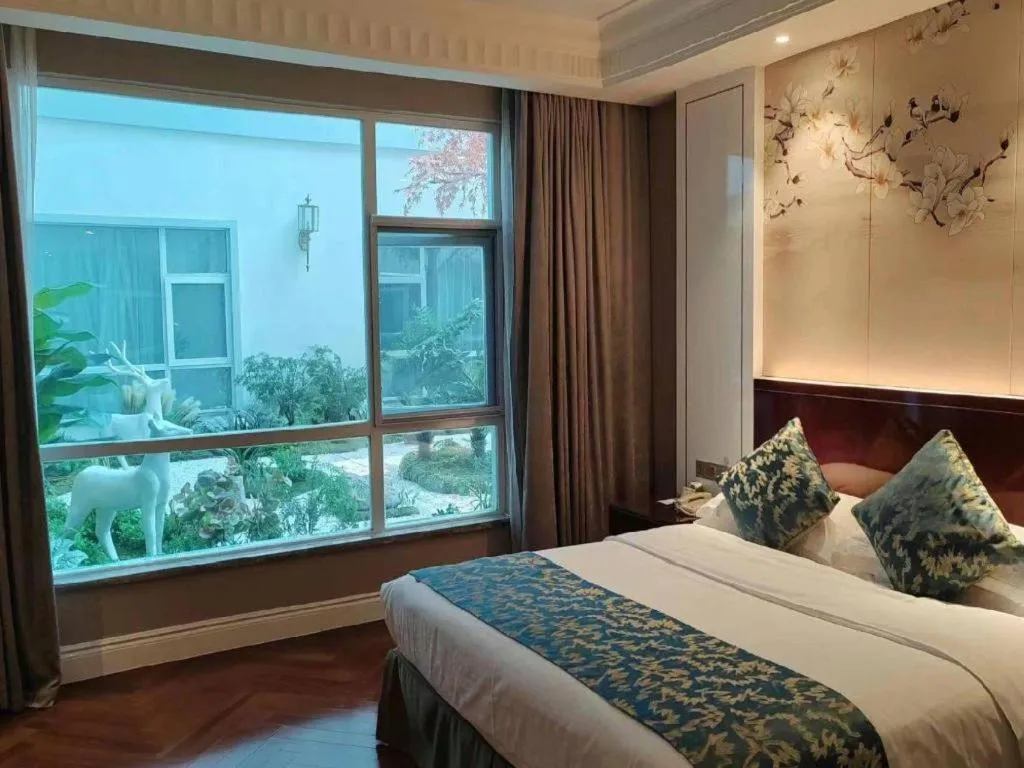 Bed in GreenTree Eastern Yancheng Binhai County Aobaolia Beichen Hotel
