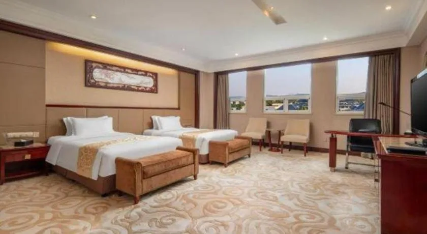 Bed in Chutian Guangdong International Hotel