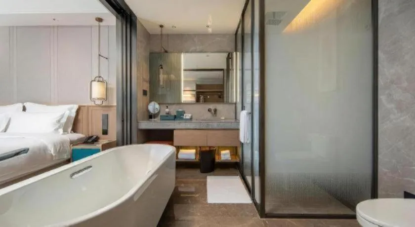 Bed in Chutian Guangdong International Hotel