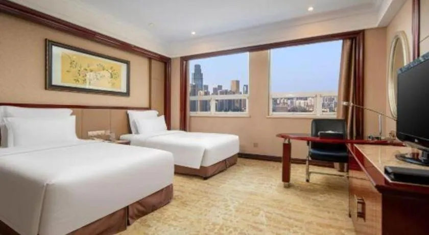 Bed in Chutian Guangdong International Hotel