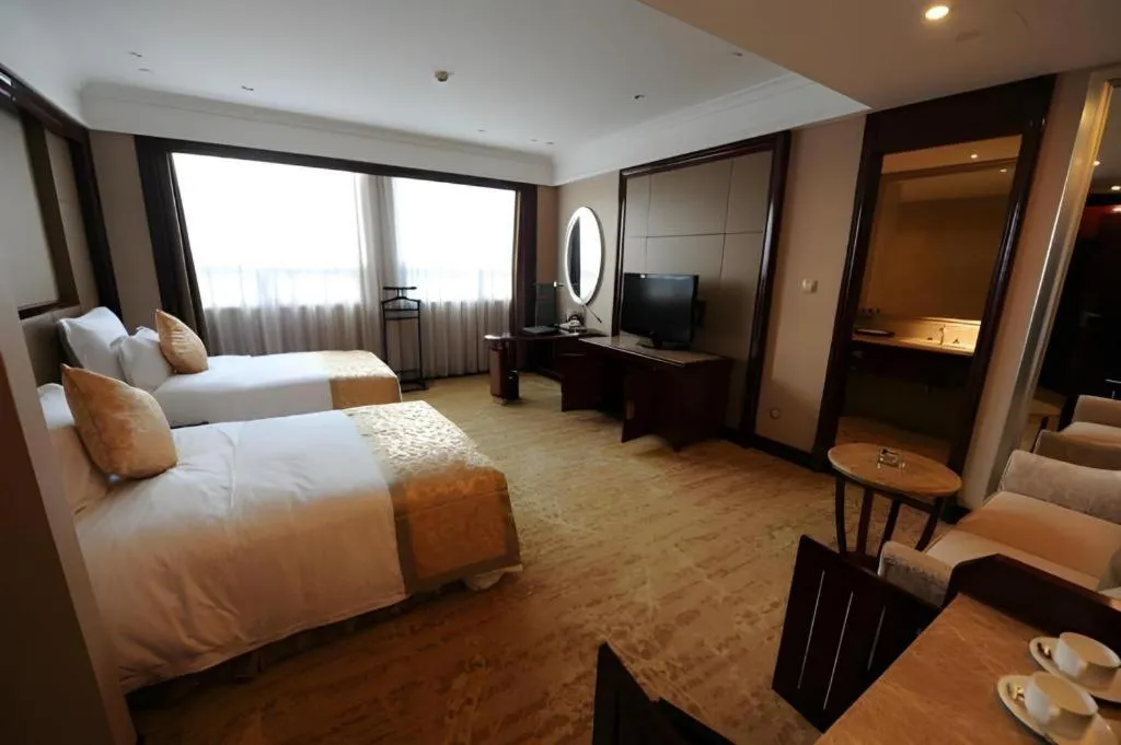 Bed in Chutian Guangdong International Hotel