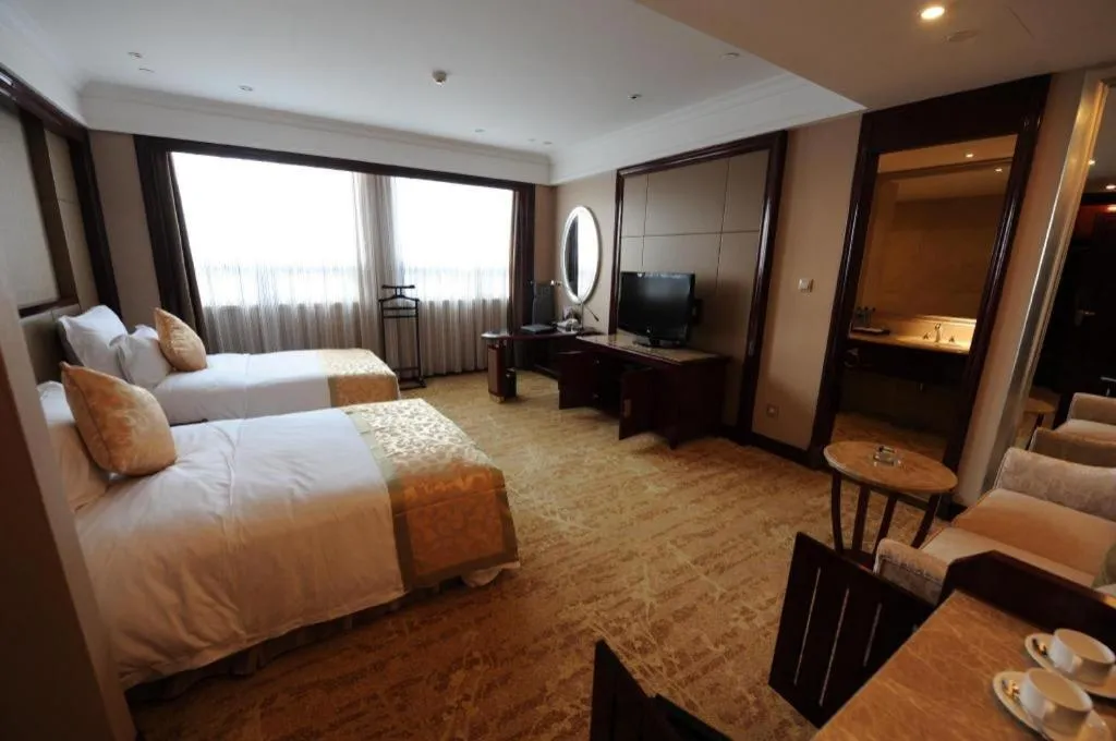 Bed in Chutian Guangdong International Hotel