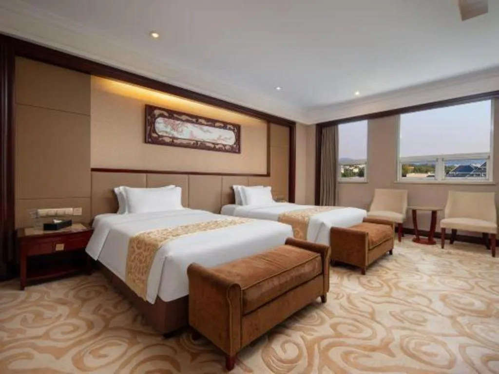 Bed in Chutian Guangdong International Hotel