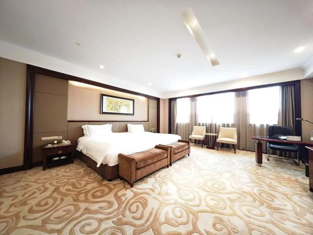 Bed in Chutian Guangdong International Hotel