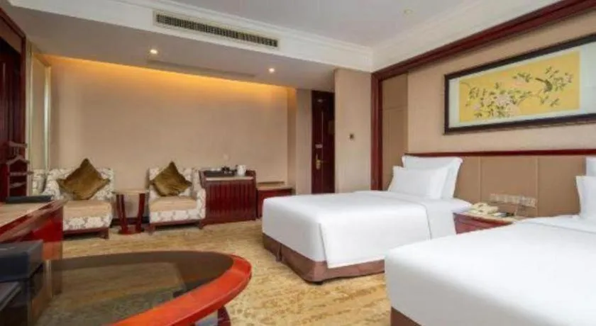 Bed in Chutian Guangdong International Hotel