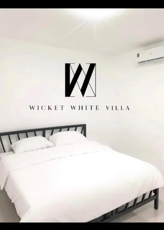 Bed in WICKET WHITE VILLA