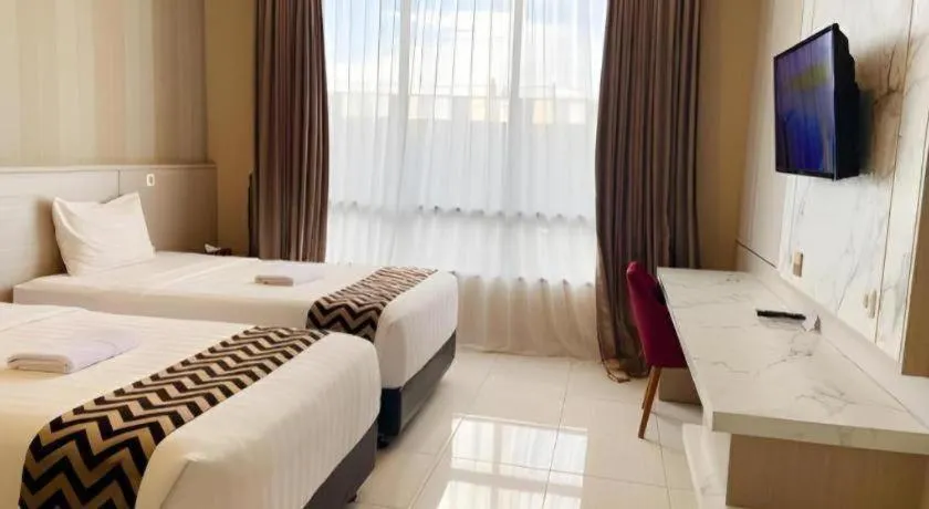 Bed in Sumbawa Grand Hotel