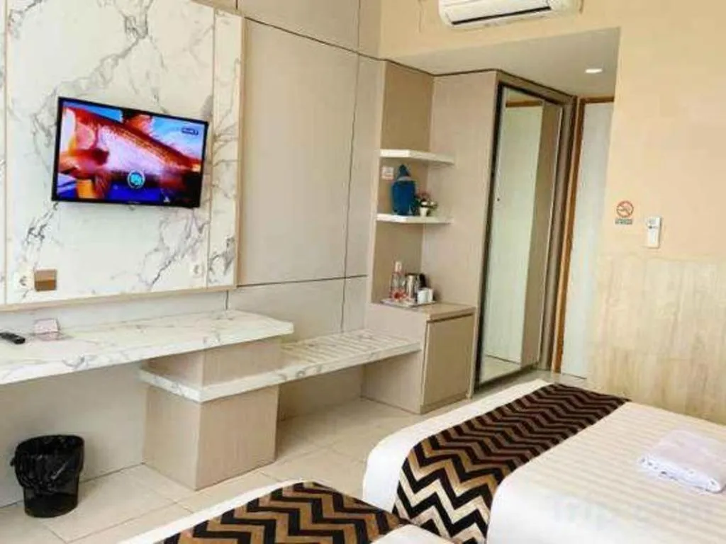 Bed in Sumbawa Grand Hotel