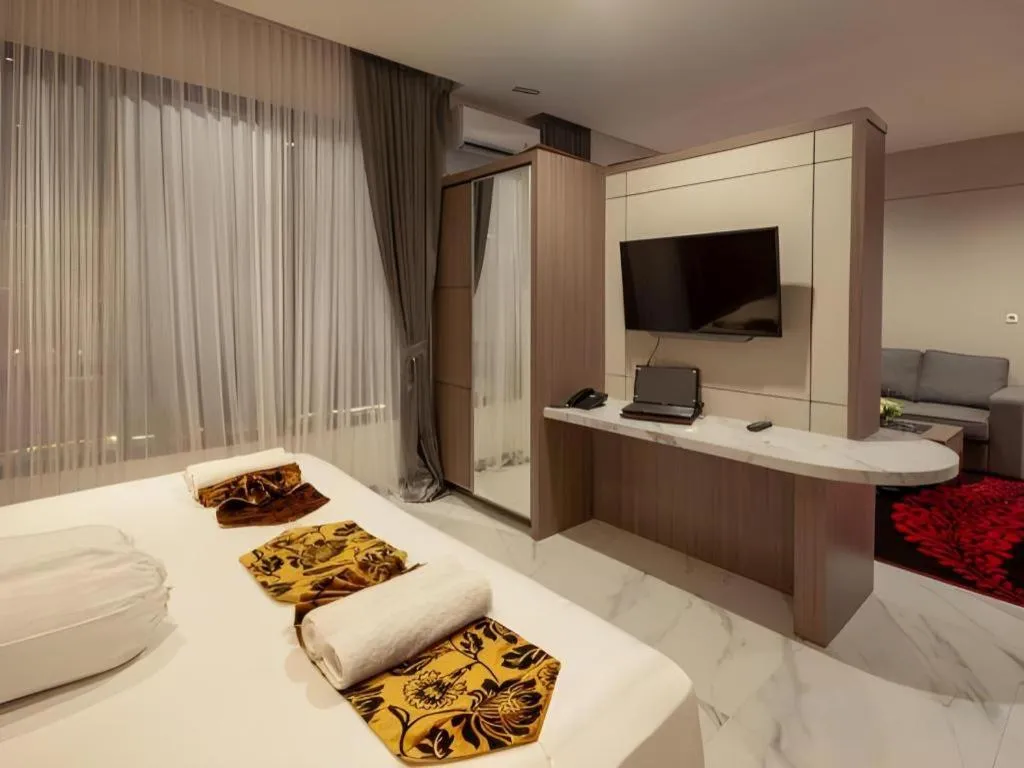 Bed in Sumbawa Grand Hotel