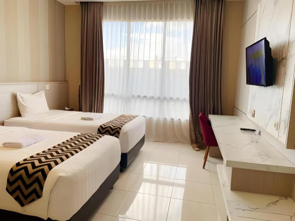 Bed in Sumbawa Grand Hotel