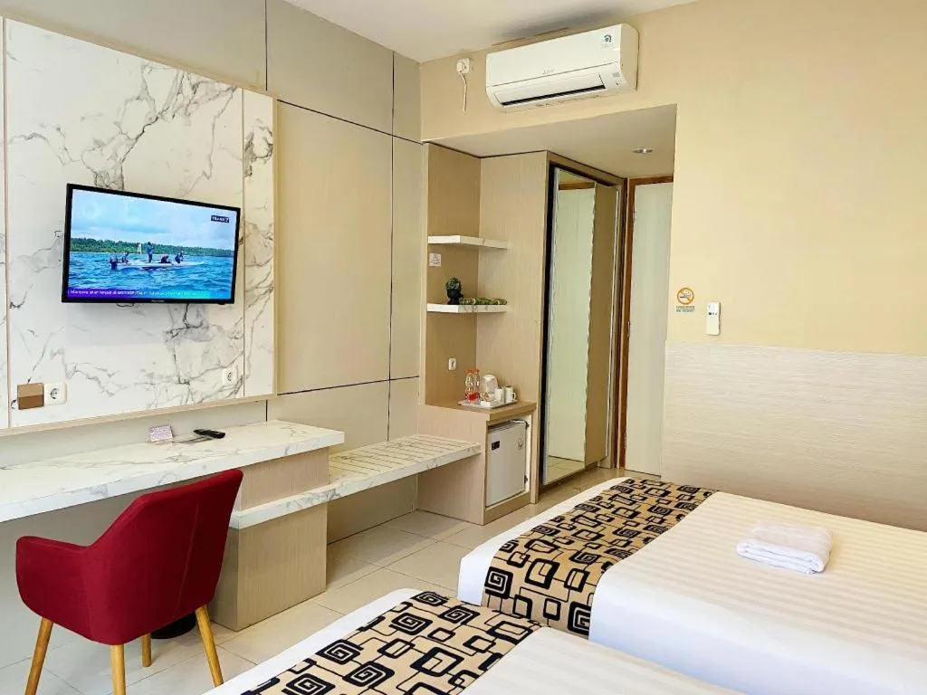 Bed in Sumbawa Grand Hotel