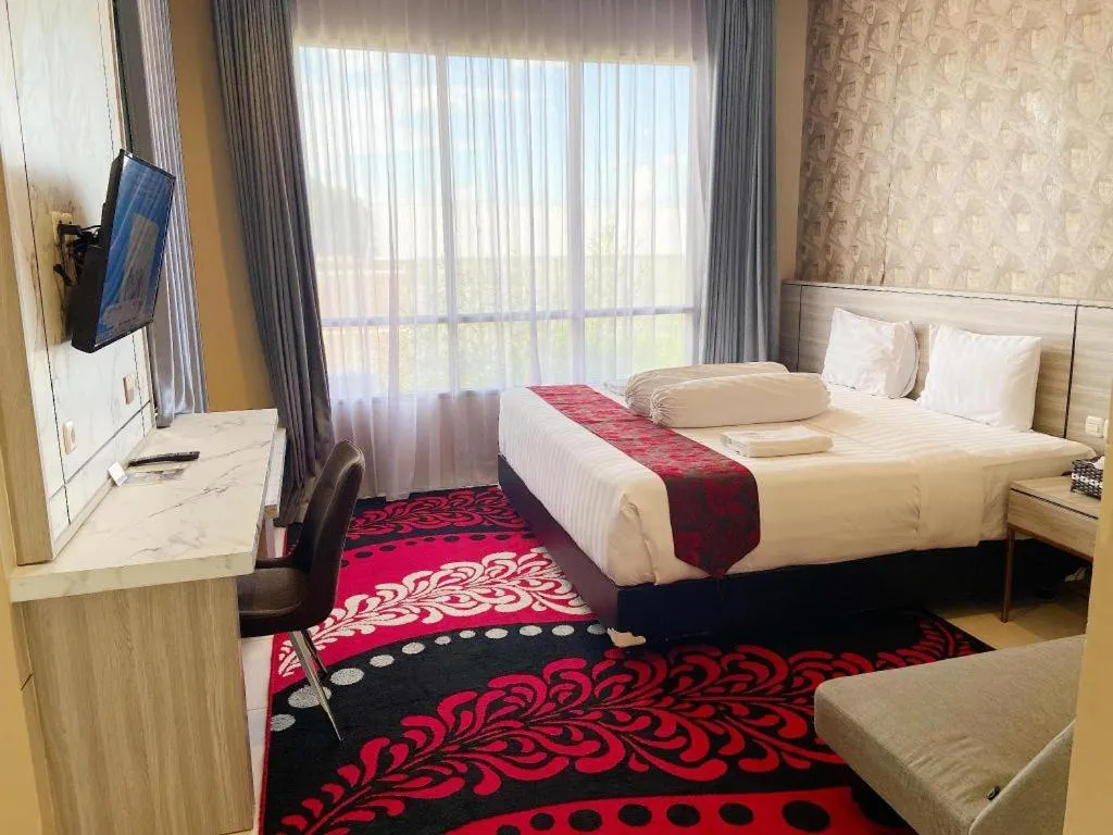 Bed in Sumbawa Grand Hotel