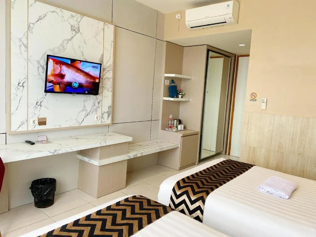 Bed in Sumbawa Grand Hotel