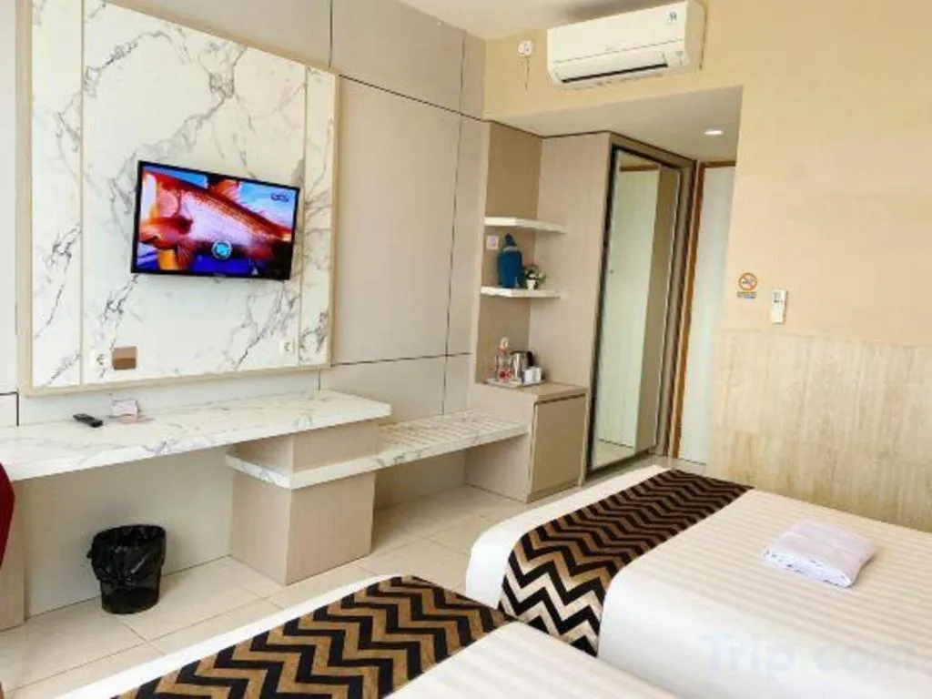 Bed in Sumbawa Grand Hotel