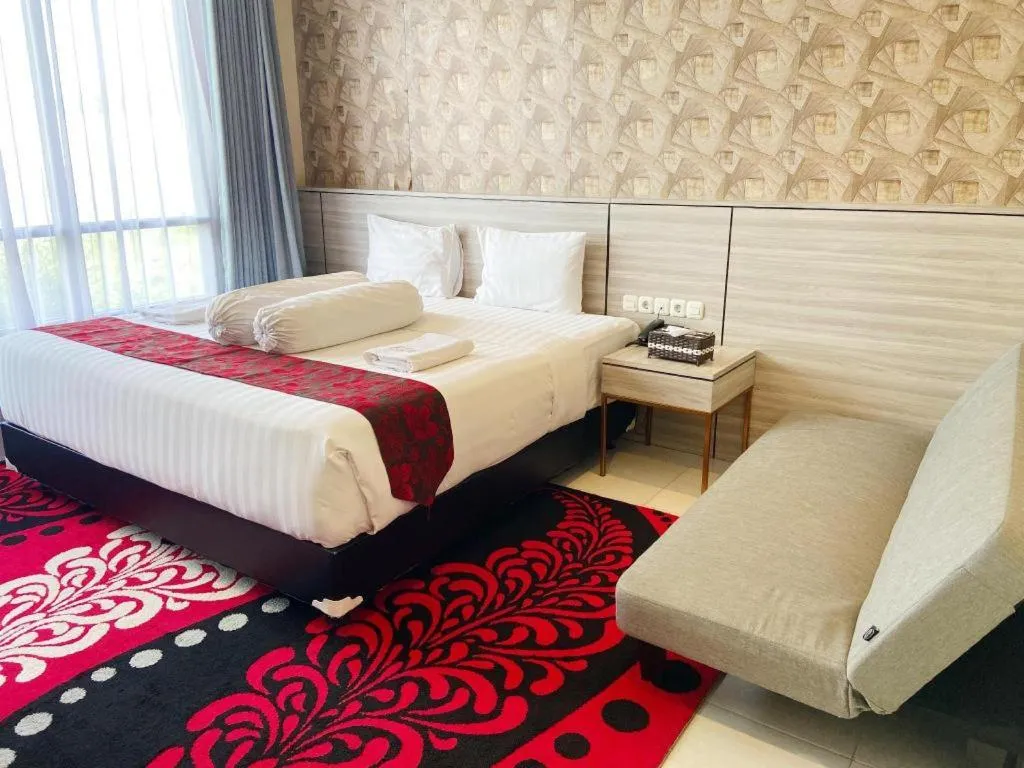 Bed in Sumbawa Grand Hotel