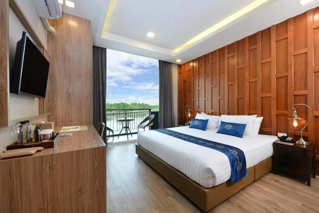 Bed in Amphawa Riverfront Hotel