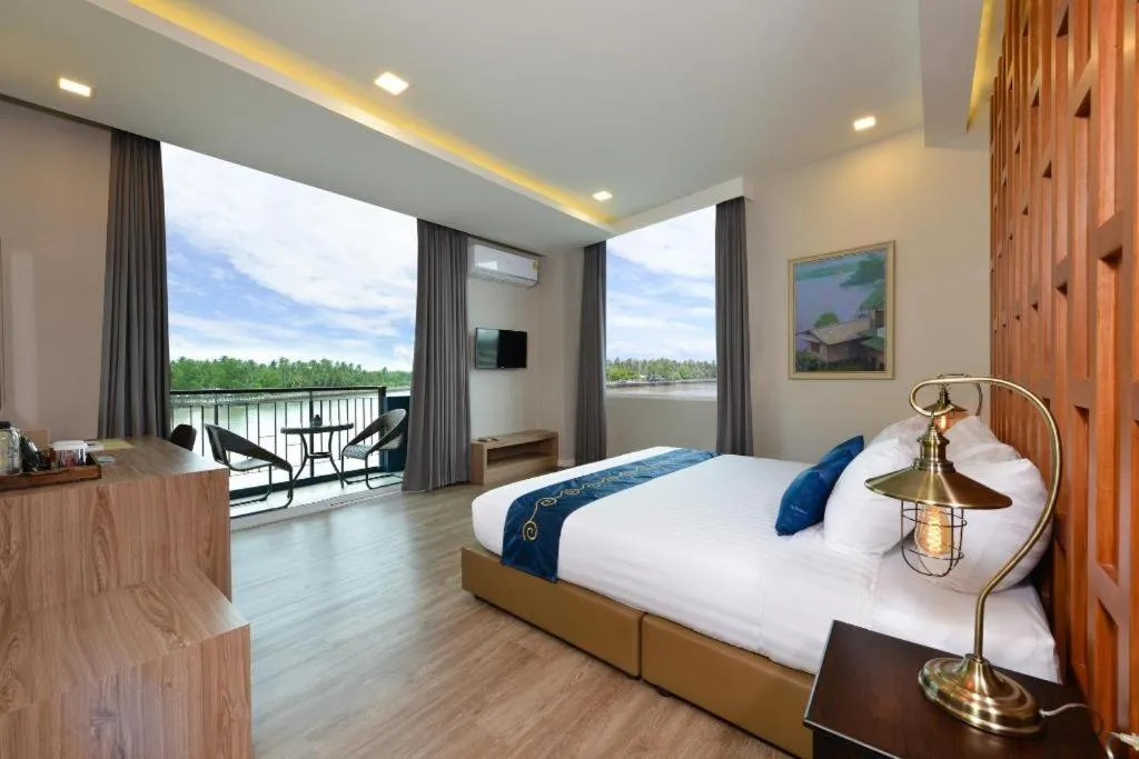 Bed in Amphawa Riverfront Hotel