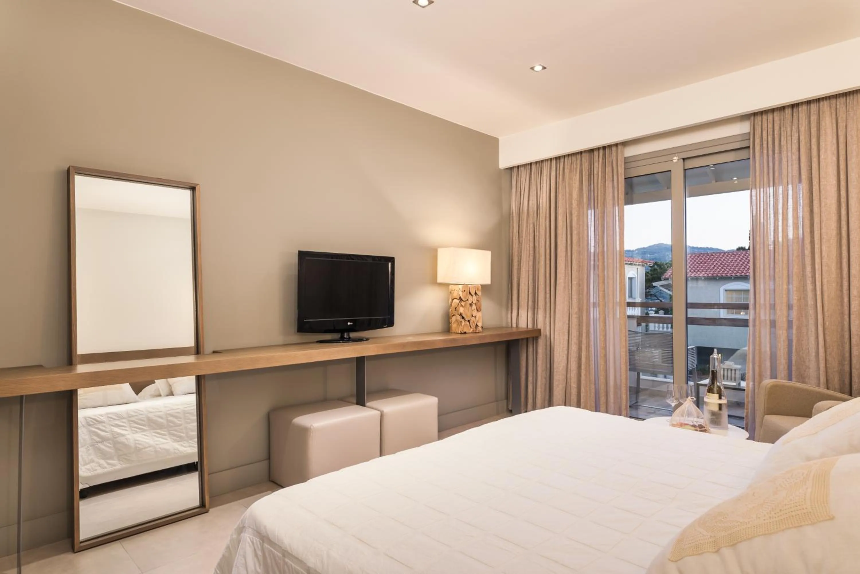 Bed in Ino Hotel & Suites